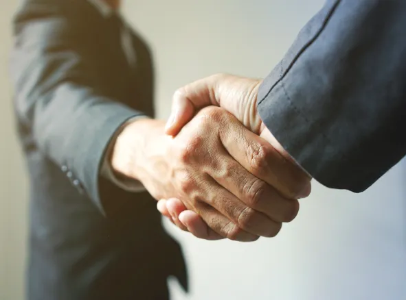 Business partnership handshake